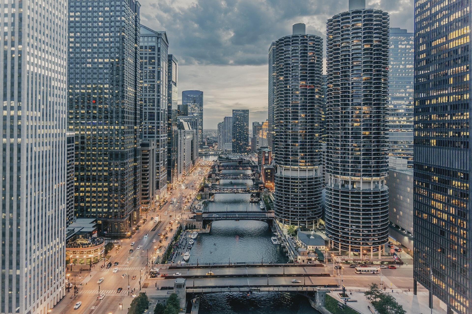 City skyline at dusk with river and bridges